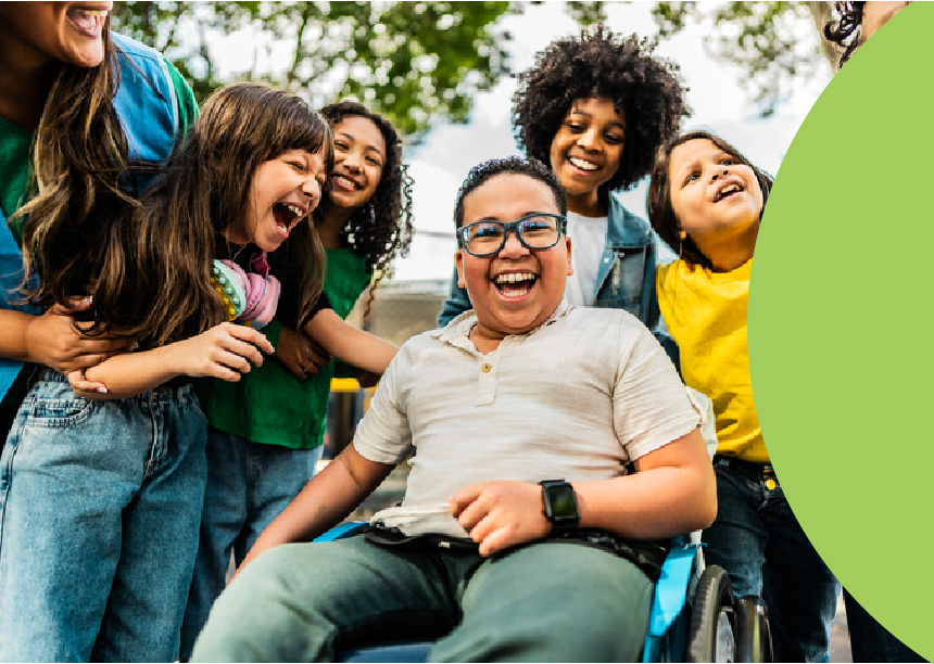 A group of children and adults laughing together